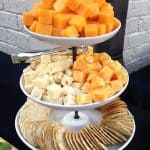 Cheese and crackers displayed on clients serving piece